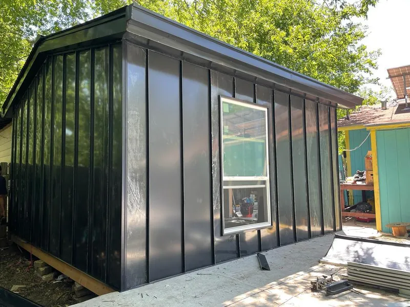 Black standing seam metal wall panels for Roof Inspection in Lockhart